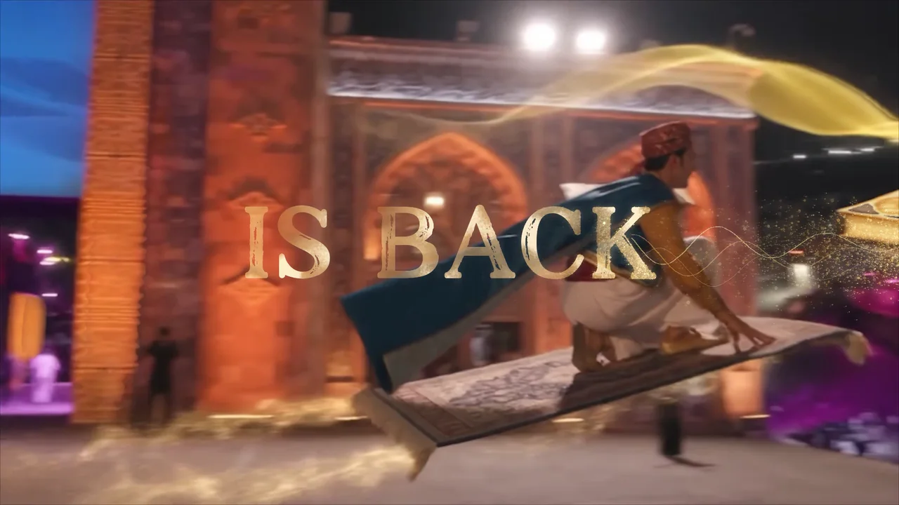 A performer travelling across the festival on a magic carpet