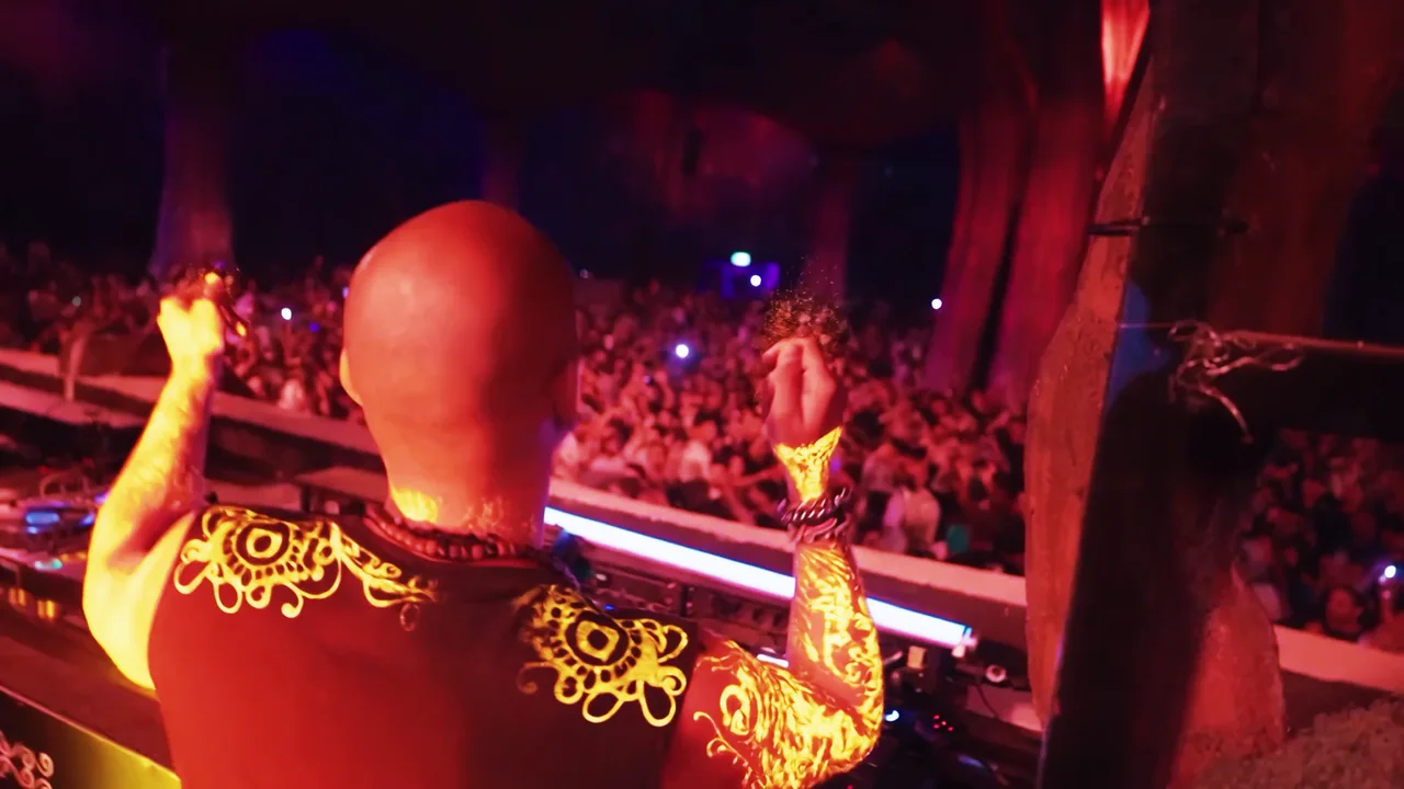 A DJ performing with ornamental AI light details carried into the final sequence
