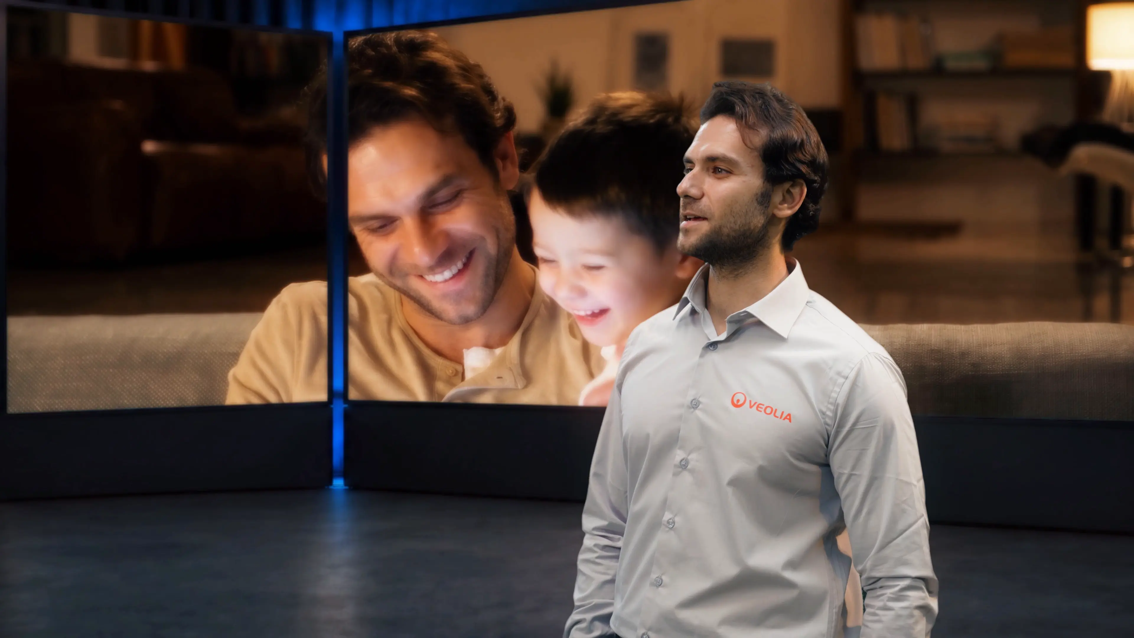 Veolia soloist performing against a screen showing a parent and child