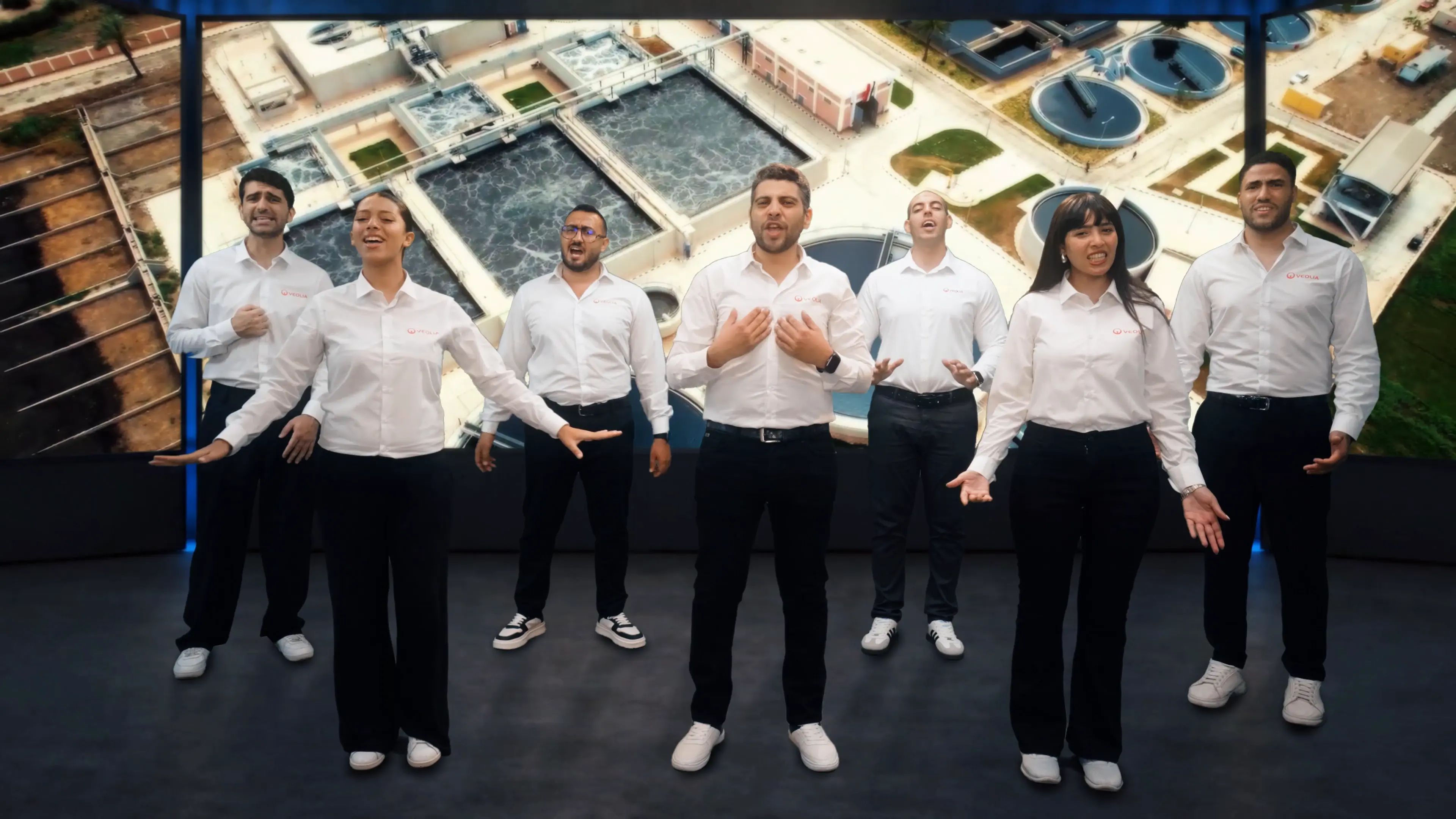 Veolia employees performing together with environmental infrastructure on the screens